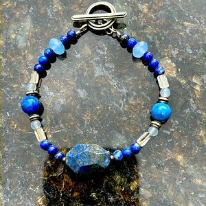 Polished and faceted stone bracelet with 925 silver